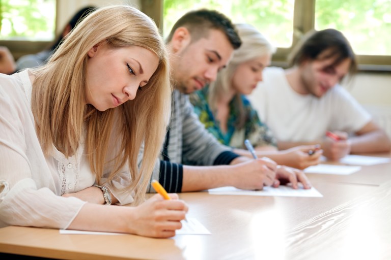 group of students takes the test in class