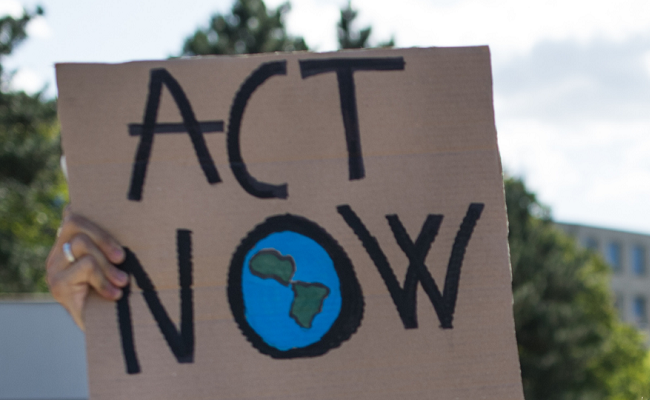 Climate website. A sign shows "Act Now"