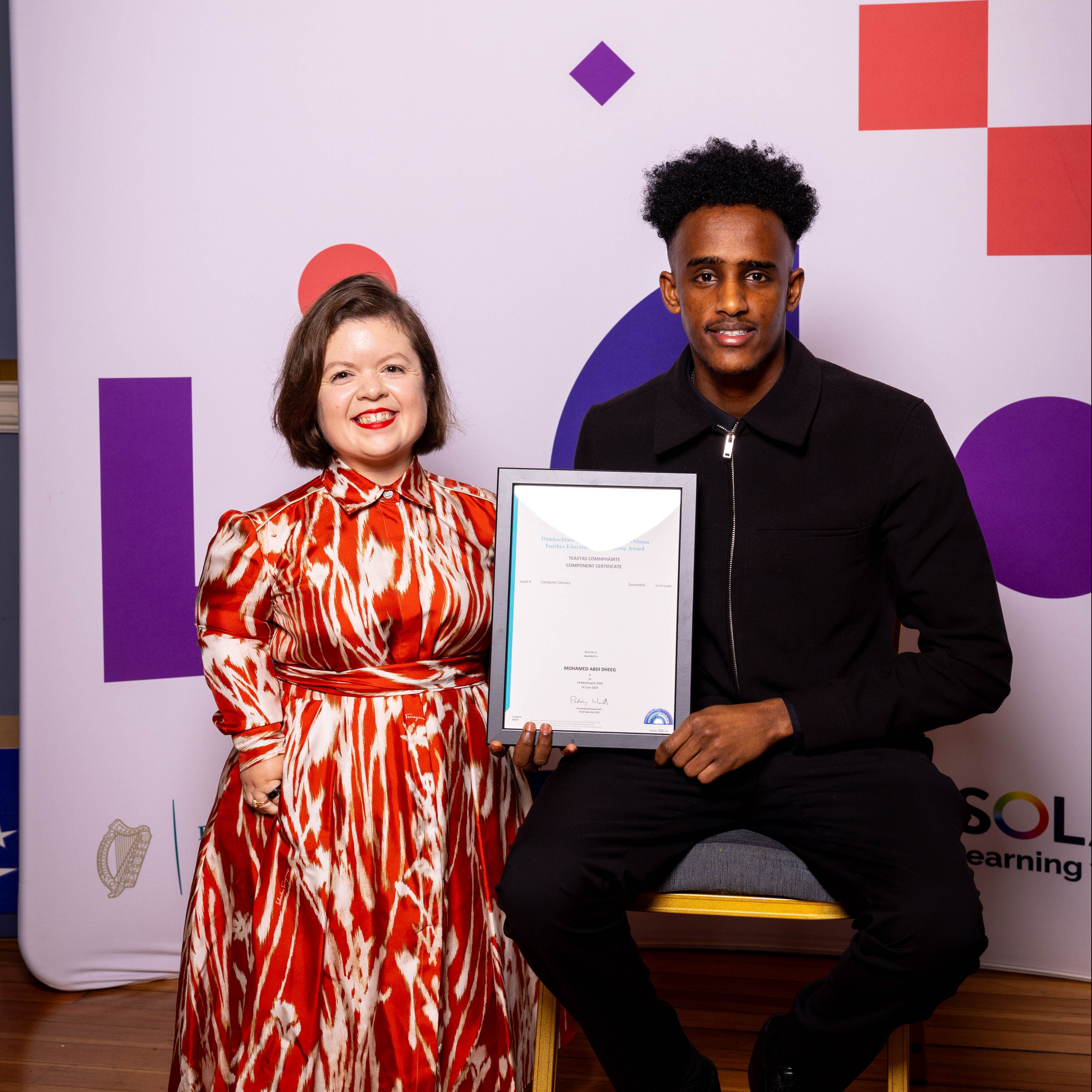 Mohamed Abi Dheeg receiving his award from Sinéad Burke